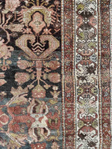 Hand-knotted vintage Persian rug with intricate border