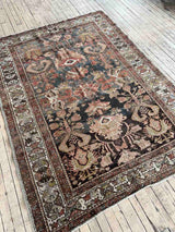 Hand-knotted vintage Persian rug on wood floor