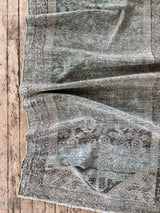 Vintage runner rug with a pattern on a wooden floor