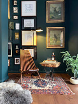 Cozy living room with Antique Persian area rug at Woven Kin Home