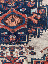 Antique Persian area rug close-up at Woven Kin Home