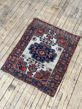 Antique Persian area rug full view at Woven Kin Home