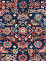 Colorful vintage Persian runner rug close-up herati pattern