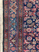 Colorful vintage Persian runner rug close-up border