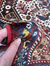 Shiny, soft wool on a vintage Persian runner rug