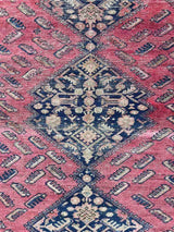 Antique Persian area rug with berry field and large medallions detail