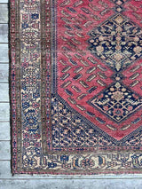 Antique Persian area rug close-up