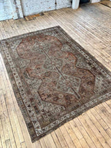Antique Persian area rug sustainable home decor at Woven Kin Home