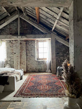 antique Persian rug at Woven Kin Home sustainable home decor