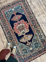 person standing on a Colorful vintage area rug