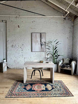 Office with desk and Colorful vintage area rug