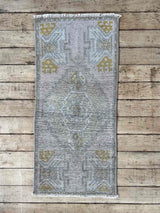 Vintage Turkish mini rug at Woven Kin Home