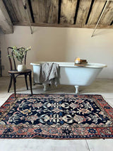 Vintage Persian rug sustainable home decor at Woven Kin Home