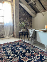 Vintage Persian rug sustainable home decor at Woven Kin Home