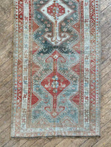 antique Persian runner rug at Petrichor Vintage Co.