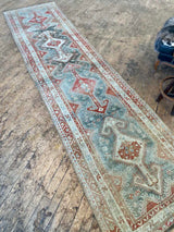antique Persian runner rug at Petrichor Vintage Co.