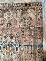 vintage Persian area rug at Petrichor Vintage Co.
