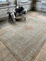 antique Persian area rug at Petrichor Vintage Co.