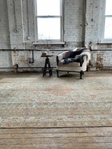 antique Persian area rug at Petrichor Vintage Co.