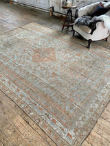 antique Persian area rug at Petrichor Vintage Co.