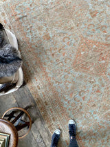 antique Persian area rug at Petrichor Vintage Co.