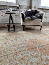 antique Persian area rug at Petrichor Vintage Co.