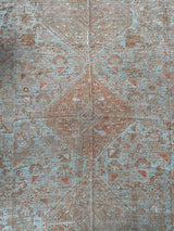 antique Persian area rug at Petrichor Vintage Co.