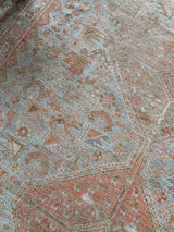 antique Persian area rug at Petrichor Vintage Co.