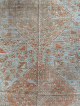 antique Persian area rug at Petrichor Vintage Co.
