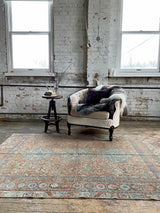 antique Persian area rug at Petrichor Vintage Co.