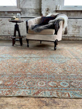 antique Persian area rug at Petrichor Vintage Co.
