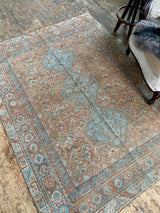 antique Persian area rug at Petrichor Vintage Co.