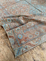 antique Persian area rug at Petrichor Vintage Co.