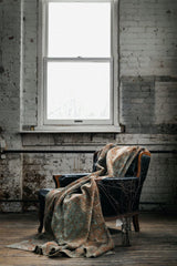 antique Persian area rug at Petrichor Vintage Co.