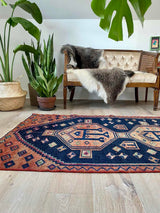vintage Persian area rug at Petrichor Vintage Co.
