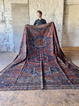 antique Caucasian area rug at Petrichor Vintage Co.