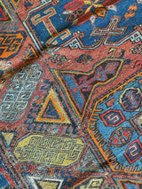 antique Caucasian area rug at Petrichor Vintage Co.