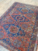 antique Caucasian area rug at Petrichor Vintage Co.