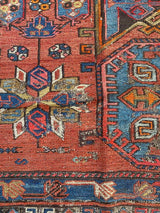 antique Caucasian area rug at Petrichor Vintage Co.
