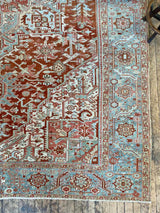 antique Persian area rug at Petrichor Vintage Co.