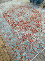 antique Persian area rug at Petrichor Vintage Co.