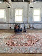 antique Persian area rug at Petrichor Vintage Co.