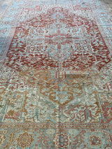 antique Persian area rug at Petrichor Vintage Co.