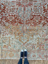 antique Persian area rug at Petrichor Vintage Co.