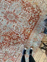 antique Persian area rug at Petrichor Vintage Co.
