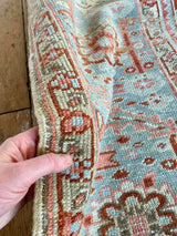 antique Persian area rug at Petrichor Vintage Co.