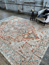 antique Persian area rug at Petrichor Vintage Co.