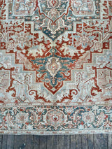 antique Persian area rug at Petrichor Vintage Co.