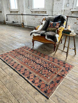 antique Perian accent rug