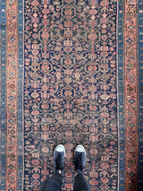 antique Persian area rug at Petrichor Vintage Co.
